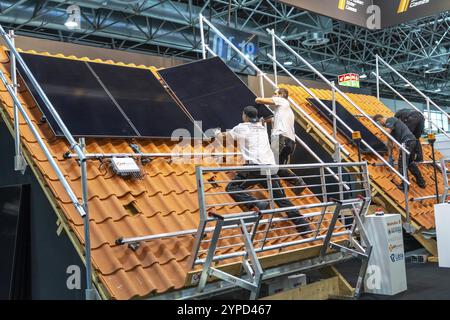 Presentation of the rapid installation of a solar system on a residential house with a pitched roof, in the form of a competition, European Solar Game Stock Photo