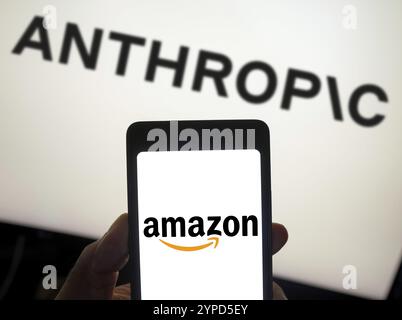 May 30, 2024, Brazil. In this photo illustration, the Amazon logo is displayed on a smartphone screen and Anthropic logo background Stock Photo