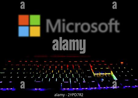 April 15, 2024, Brazil. In this photo illustration, the Microsoft Corporation logo is displayed on the computer screen with a keyboard of colored ligh Stock Photo