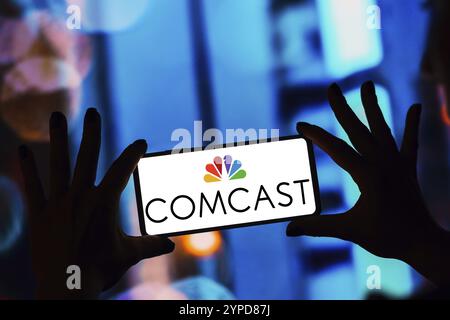 April 8, 2024, Brazil. In this photo illustration, the Comcast logo is displayed on a smartphone screen Stock Photo