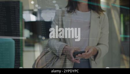 Programming code image over woman using smartphone in modern office Stock Photo
