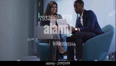 Business professionals discussing documents with numbers image over office setting Stock Photo