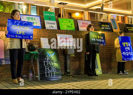 Seoul, South Korea - October 28, 2024: Anti abortion pro-life protesters holding signs in the Myeongdong area of Seoul, South Korea. Stock Photo