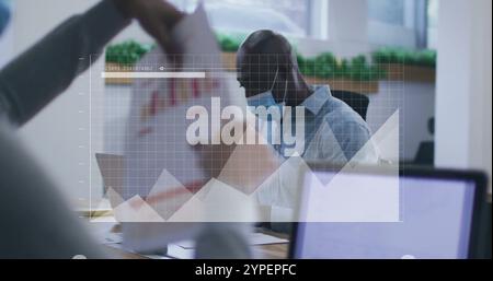 Image of financial data processing over diverse business people in face masks in office Stock Photo