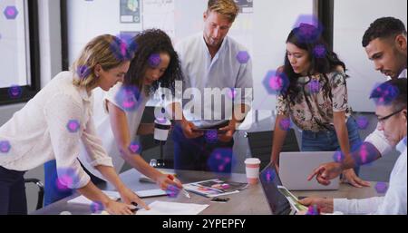 Business team collaborating over digital blockchain image with purple hexagons Stock Photo