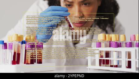 Analyzing blood samples, scientist with text image over laboratory scene Stock Photo