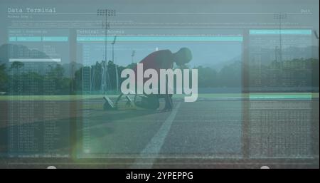 Data terminal access image over athlete preparing to start on running track Stock Photo