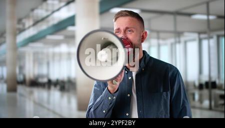 Man Making Megaphone Announcement. Warning Concept Speaker Stock Photo