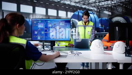 Oil And Gas Automation. Diverse Workers Using Control Computers Stock Photo