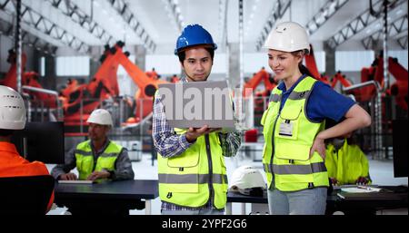 Worker In Automotive Car Factory Using Tablet Stock Photo