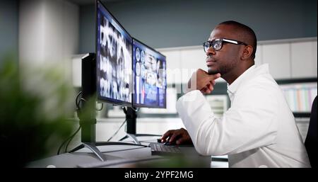 Dentist Doctor Looking At Teeth Xray On Computer Stock Photo