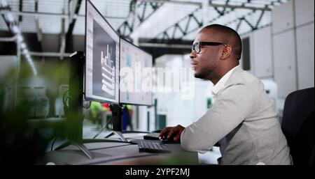 Engineer Doing 3D CAD Model Design On Computer At Factory Stock Photo