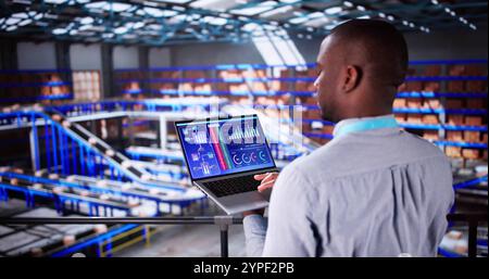 Engineer Worker Using Warehouse Automation Dashboard In Logistic Center Stock Photo