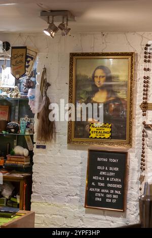 Interior, Battlesbridge Mill Antiques Centre, Essex, UK: 'Nothing worth stealing here', with Mona Lisa (reproduction!) Stock Photo