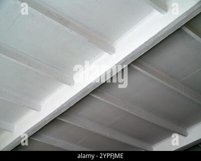 Ceiling concrete floor slab and beams structure, concept image for modern and contemporary architecture diagonal composition selective focus shot. Stock Photo