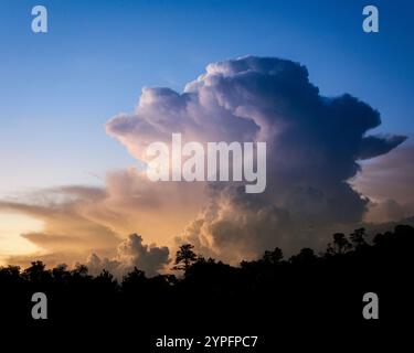 Late afternoon light works through the clouds around Granite Mountain outside of Prescott, Arizona. Stock Photo