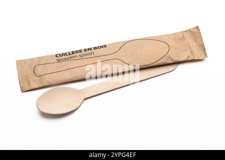 Two enviromentaly friendly disposable wooden spoons, one in it's packaging Stock Photo