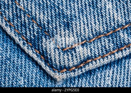 Jeans texture. Closeup of blue jeans fabric with stitch Stock Photo