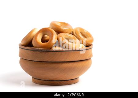 Bagels in wooden bowl on white background, isolated Stock Photo