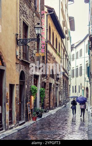 Florence, Italy; November 17, 2024: Street of Florence on a rainy day Stock Photo