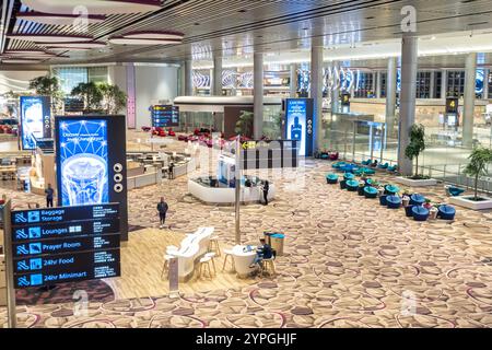 Singapore Changi Airport Terminal 4 - top view, looking down. Direction signs Stock Photo