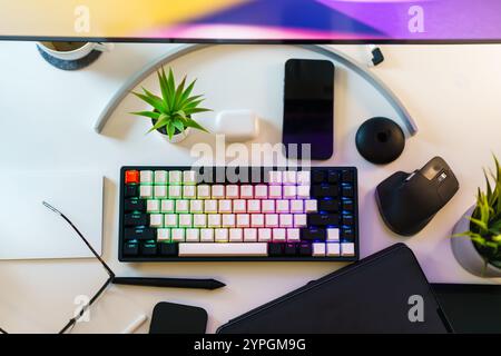 home office desktop electronic devices keyboard mouse graphic tablet from top creative blogger space Stock Photo