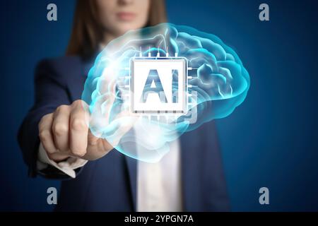 Artificial intelligence. Businesswoman touching virtual brain with AI chip on dark blue background, closeup Stock Photo