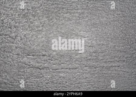 Surface painted with silver paint with streaks and microcracks from age Stock Photo