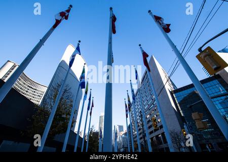 Flags at Nathan Phillips Square on Bay Street in downtown Toronto, Ontario, Canada Stock Photo