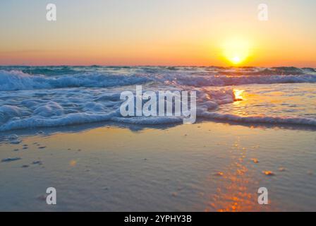 Beach scene with close-up waves and sand Stock Photo