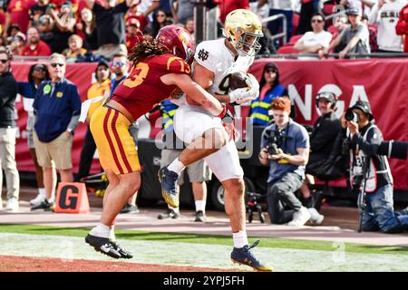 Los Angeles, CA. 30th Nov, 2024. Notre Dame Fighting Irish tight end Eli Raridon (9) catches the pass for the touchdown over USC Trojans linebacker Mason Cobb (13) in the end zone in action in the second quarter during the NCAA Football game between the Notre Dame Fighting Irish and the USC Trojans at the Coliseum in Los Angeles, California.Mandatory Photo Credit: Louis Lopez/Cal Sport Media/Alamy Live News Stock Photo