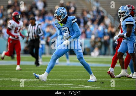 Durham, North Carolina, USA. 30th Nov, 2024. UNC defensive back MALCOLM ZIGLAR celebrates after tackling an NC State kick returner for no gain. The North Carolina Tar Heels hosted NC State at Kenan Memorial Stadium in Chapel Hill. (Credit Image: © Patrick Magoon/ZUMA Press Wire) EDITORIAL USAGE ONLY! Not for Commercial USAGE! Credit: ZUMA Press, Inc./Alamy Live News Stock Photo