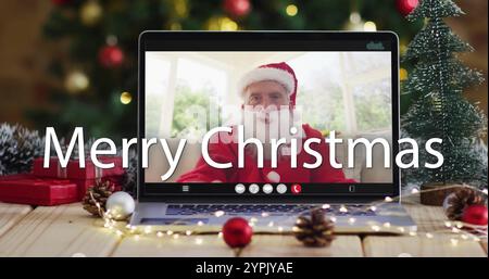Image of merry christmas text over santa claus on laptop screen and christmas decorations Stock Photo