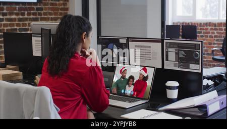 Young biracial woman works in a modern office, with copy space Stock Photo