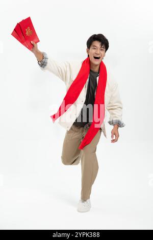 Young Asian man holding Chinese red lantern Stock Photo