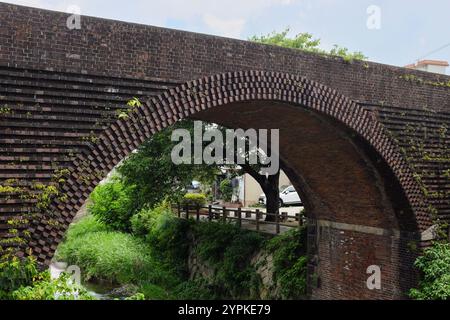 Due to earthquakes, brick constructions are rare in Japan. This is a disused bridge in Kyushu, Japan, made with bricks. Stock Photo