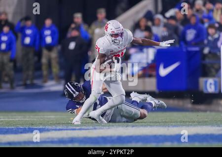 November 30, 2024, Provo, Utah, USA: November 30th, 2024; Provo, Utah, USA; Running back STACY SNEED (21) of the Houston Cougars runs the ball while avoiding a tackle during the NCAA Football game between Houston and BYU at Lavell Edwards Stadium. (Credit Image: © Darrin Fry/ZUMA Press Wire) EDITORIAL USAGE ONLY! Not for Commercial USAGE! Stock Photo