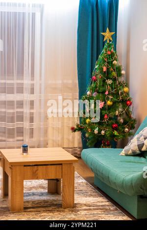Shot of the small apartment with christmas tree decorated Stock Photo