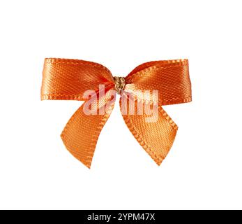 Vibrant orange tied bow isolated on white background. Satin tied bow is design element for gift wrapping decorations, festive projects and creative de Stock Photo