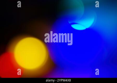 Abstract background of red, yellow and blue spots of light Stock Photo