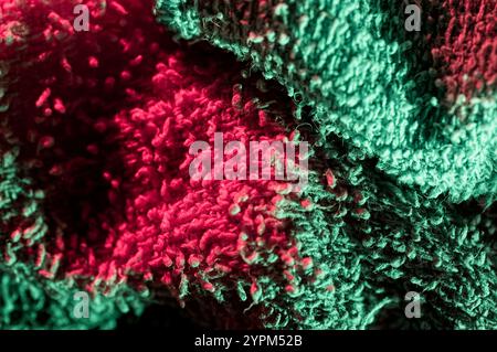 Close up of cloth texture bathed in green and red light Stock Photo