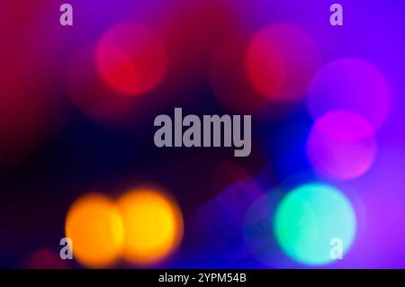 Colored orbs of red, yellow and blue light in an abstract Stock Photo