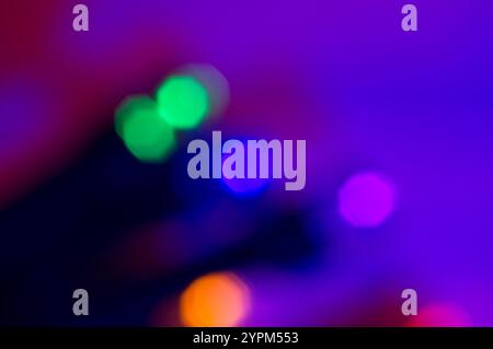 Octagonal orbs or green, blue and pink light in an abstract background Stock Photo