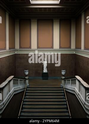 Elegant Marble Staircase and Classical Statue in a Grand Museum Interior with Ornate Wall Designs Stock Photo