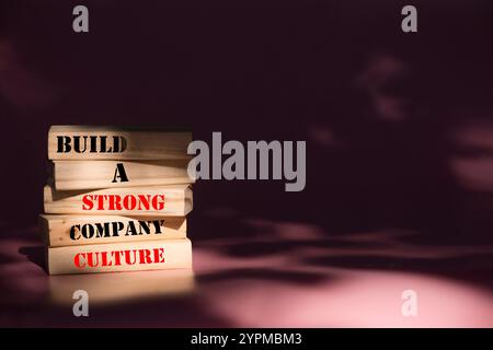 Company culture symbol. Wooden blocks with words Build a strong company culture. Beautiful pink background. Business and Company culture concept. Copy Stock Photo