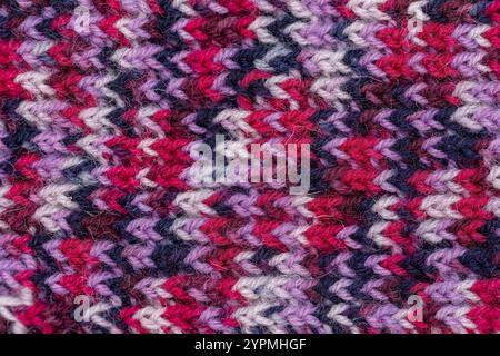 Handmade Knitting Texture in Blue, Brown, Dark Red, and White Wool. Stock Photo