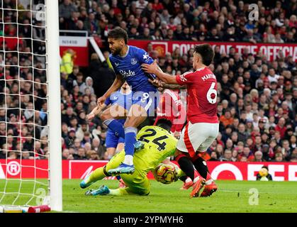 Manchester, UK. 1st Dec, 2024. Manchester United's goalkeeper Andre Onana saves from Everton's Dominic Calvert-Lewin during the Premier League match at Old Trafford, Manchester. Picture credit should read: Andrew Yates/Sportimage Credit: Sportimage Ltd/Alamy Live News Stock Photo