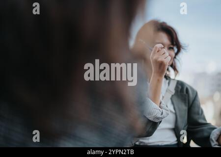 Casual outdoor business meeting with colleagues exchanging ideas Stock Photo