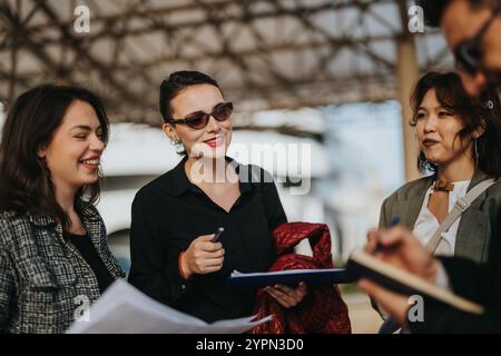 Multicultural team discussing growth strategies for business success outdoors Stock Photo