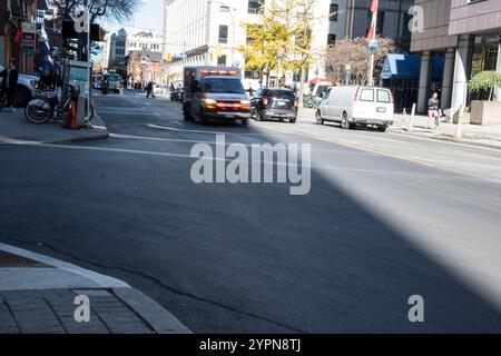 Ambulance on King Street West in downtown Toronto, Ontario, Canada Stock Photo